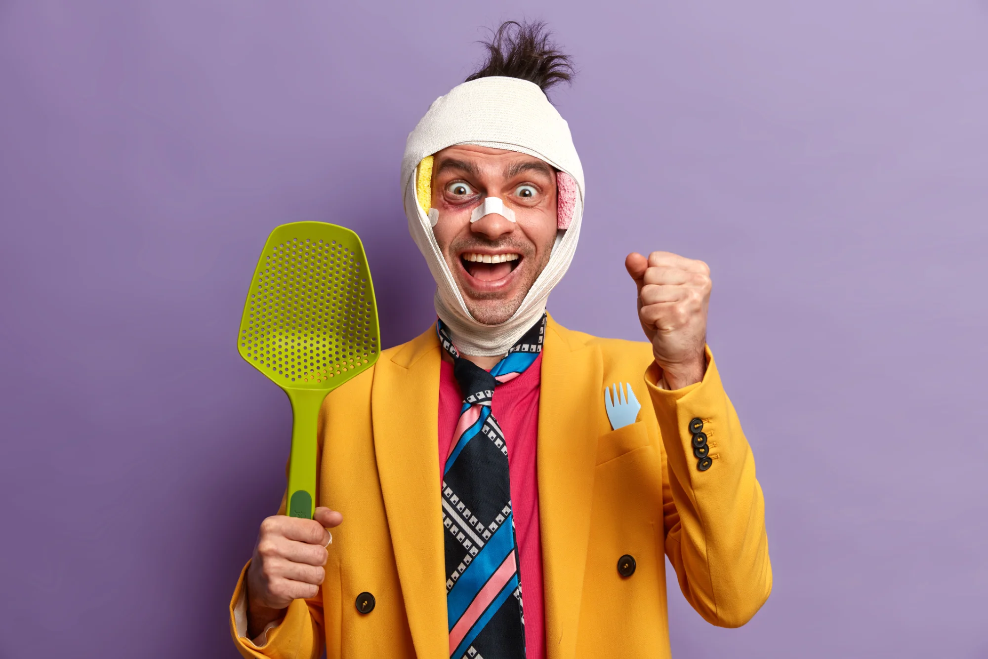 Laughing man with bandaged head holding green tool 2026 03 17 02 45 23 utc