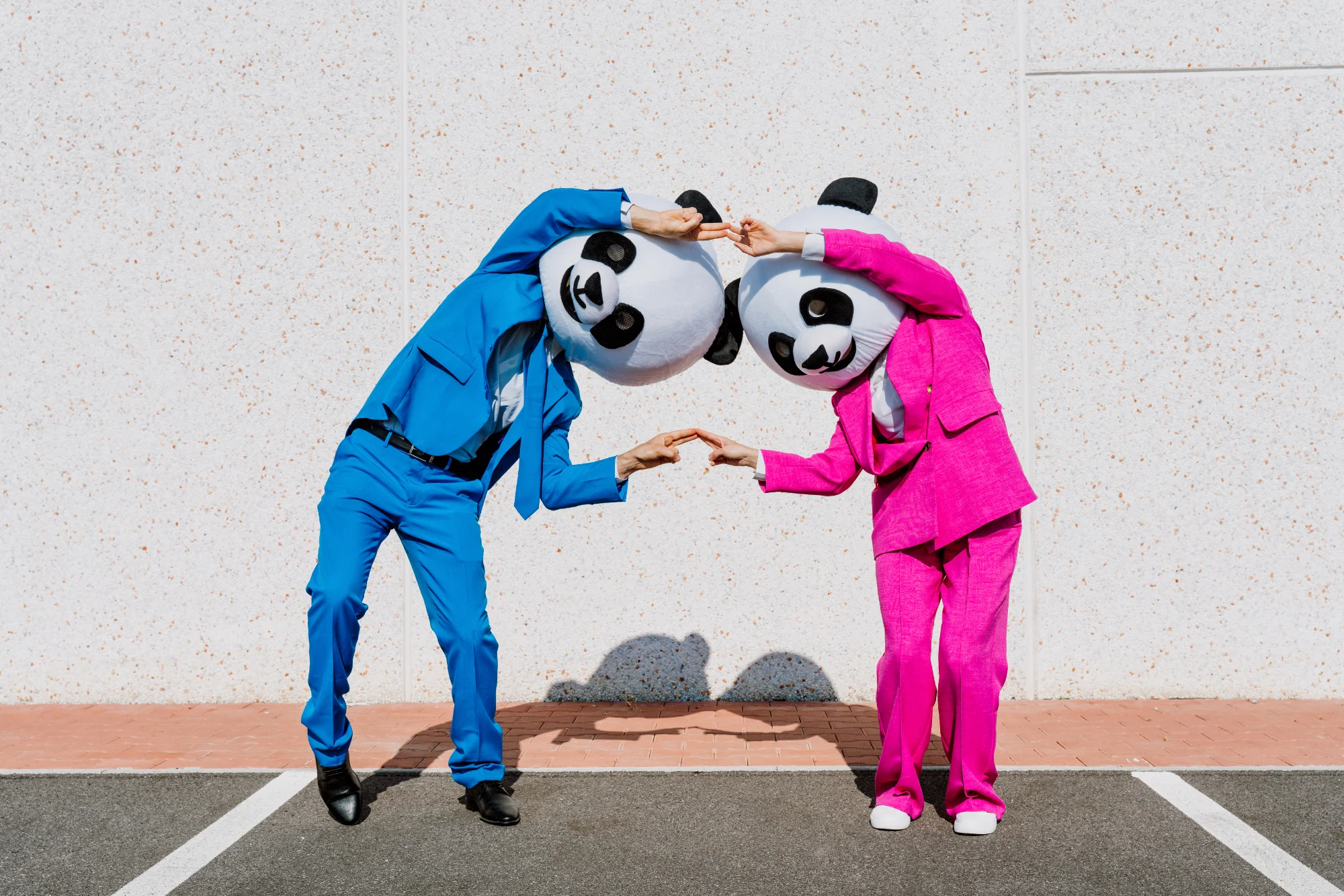 Panda mascot duo in colorful suits playfully posin 2026 03 24 11 20 19 utc 1