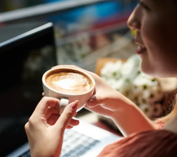 Woman enjoying coffee while working on laptop 2026 03 18 14 55 10 utc 360x320